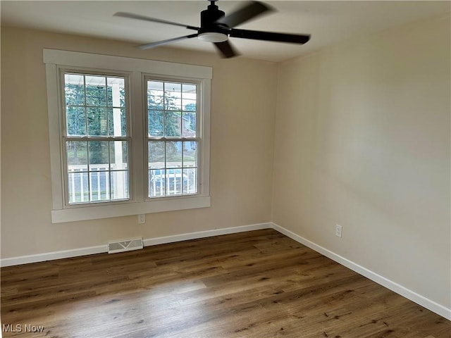 832 Meese Rd NE, Louisville, OH 44641 - spare room with wood finished floors and ceiling fan