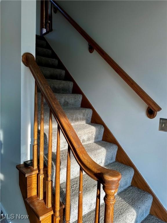832 Meese Rd NE, Louisville, OH 44641 - stairs with wood finished floors and baseboards