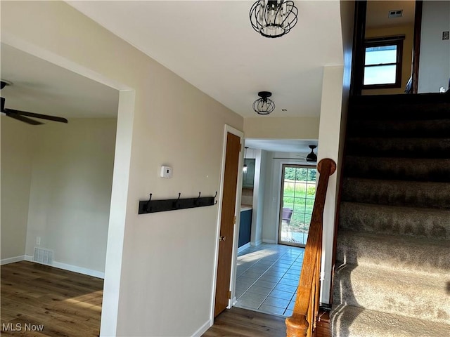 832 Meese Rd NE, Louisville, OH 44641 - stairway with a ceiling fan and wood finished floors