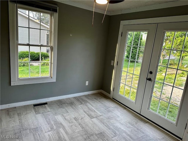 832 Meese Rd NE, Louisville, OH 44641 - doorway featuring french doors, plenty of natural light, and ceiling fan