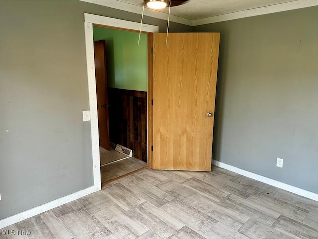832 Meese Rd NE, Louisville, OH 44641 - spare room featuring baseboards and a ceiling fan