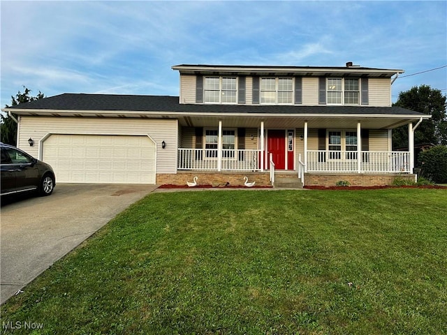 832 Meese Rd NE, Louisville, OH 44641 - view of front of house featuring an attached garage, a porch, concrete driveway, and a front lawn