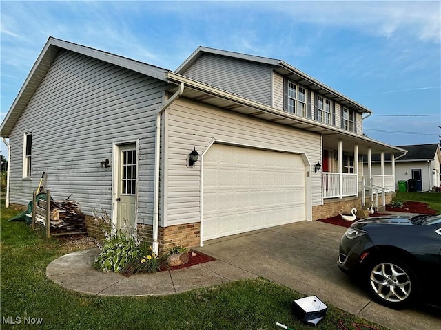 832 Meese Rd NE, Louisville, OH 44641 - view of property exterior featuring driveway and covered porch