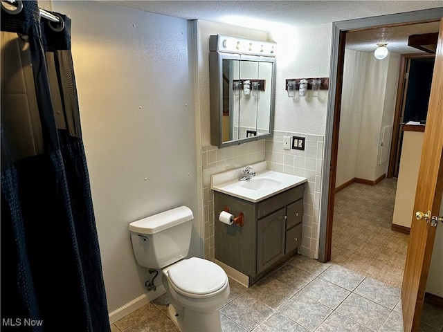 832 Meese Rd NE, Louisville, OH 44641 - bathroom featuring vanity, tile patterned flooring, and decorative backsplash