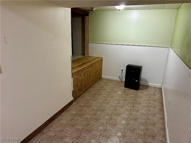 832 Meese Rd NE, Louisville, OH 44641 - spare room featuring wainscoting and tile patterned floors