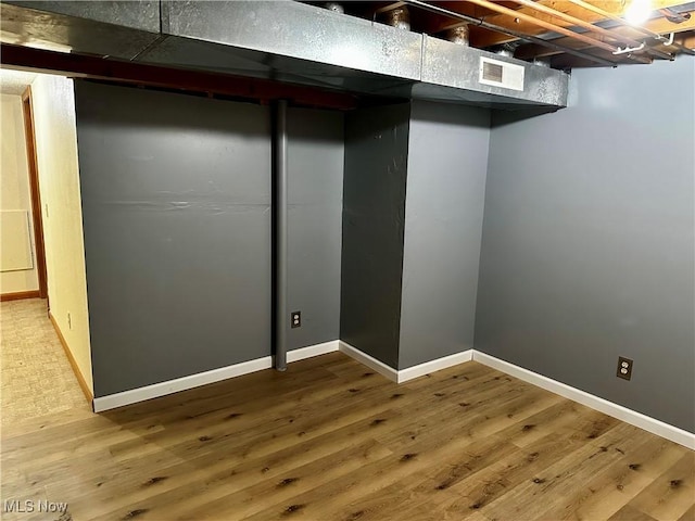 832 Meese Rd NE, Louisville, OH 44641 - finished below grade area featuring wood finished floors and baseboards