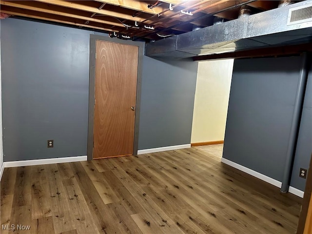 832 Meese Rd NE, Louisville, OH 44641 - finished basement featuring wood finished floors and baseboards