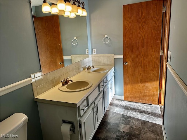 832 Meese Rd NE, Louisville, OH 44641 - bathroom featuring toilet and double vanity