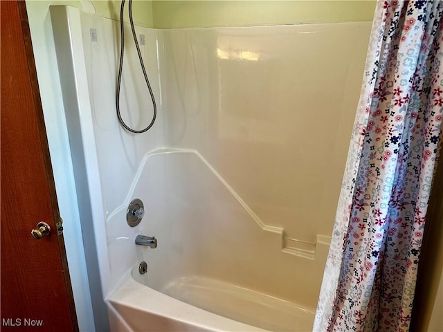 832 Meese Rd NE, Louisville, OH 44641 - bathroom featuring shower / bath combination with curtain