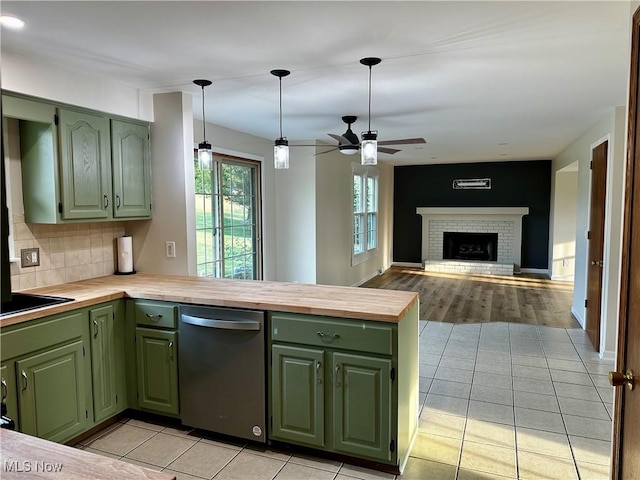 832 Meese Rd NE, Louisville, OH 44641 - kitchen with green cabinets, stainless steel dishwasher, and a peninsula