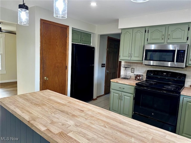 832 Meese Rd NE, Louisville, OH 44641 - kitchen featuring black appliances, green cabinets, backsplash, and wooden counters