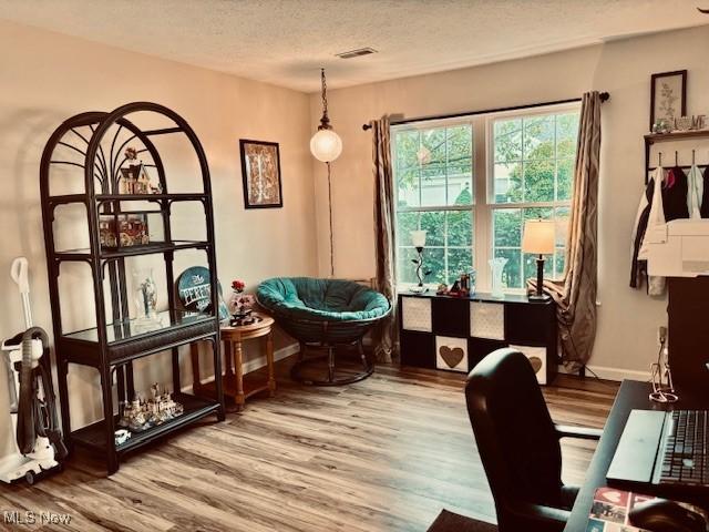 15539 Nantucket Cv # 3, Middlefield, OH 44062 - sitting room featuring wood finished floors and a textured ceiling