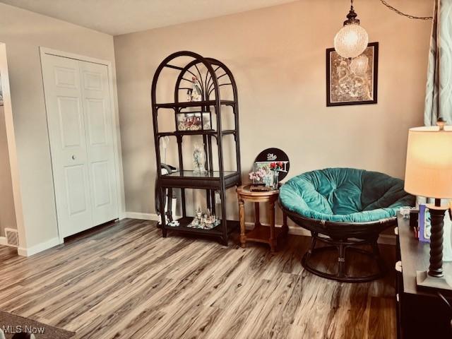 15539 Nantucket Cv # 3, Middlefield, OH 44062 - living area with wood finished floors and baseboards