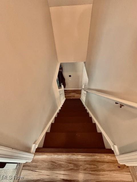 15539 Nantucket Cv # 3, Middlefield, OH 44062 - stairway featuring wood finished floors and baseboards