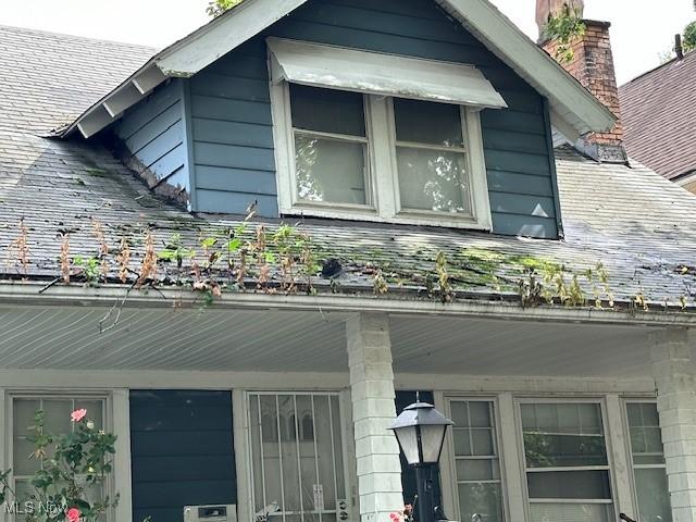 499 E 124th St, Cleveland, OH 44108 - exterior view of a chimney and roof with shingles