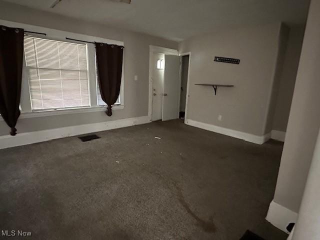 499 E 124th St, Cleveland, OH 44108 - unfurnished living room with baseboards