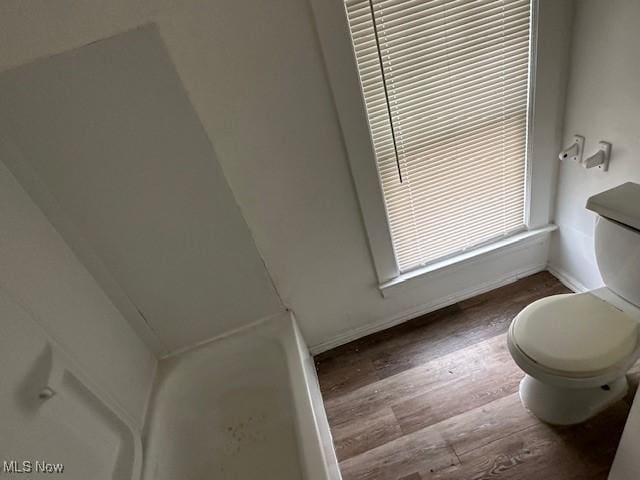 499 E 124th St, Cleveland, OH 44108 - full bathroom with toilet and wood finished floors