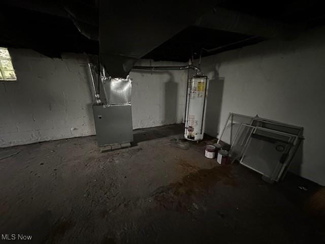 499 E 124th St, Cleveland, OH 44108 - unfinished basement featuring gas water heater and heating unit