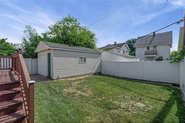 4305 W 49th St, Cleveland, OH 44144 - fenced backyard with an outdoor structure and a garage