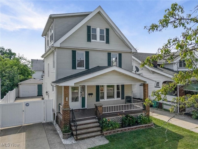 4305 W 49th St, Cleveland, OH 44144 - view of front facade featuring a gate, a porch, a detached garage, an outdoor structure, and driveway