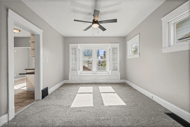 4305 W 49th St, Cleveland, OH 44144 - carpeted spare room with a ceiling fan and baseboards
