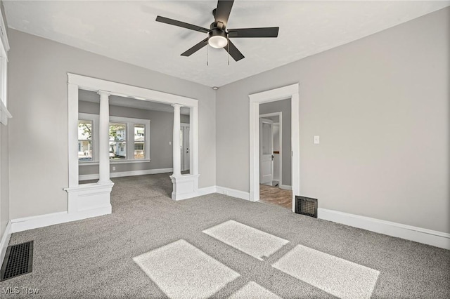 4305 W 49th St, Cleveland, OH 44144 - unfurnished bedroom with ornate columns, carpet, and ceiling fan