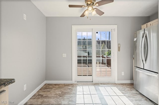 4305 W 49th St, Cleveland, OH 44144 - unfurnished dining area with a ceiling fan and baseboards