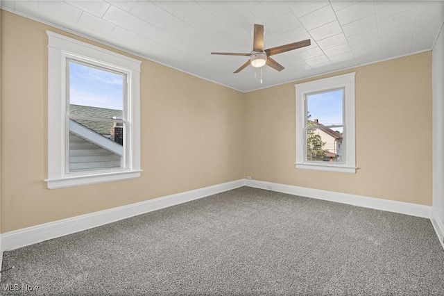 4305 W 49th St, Cleveland, OH 44144 - empty room featuring ornamental molding, healthy amount of natural light, a ceiling fan, and carpet flooring