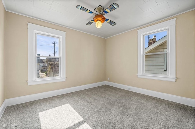 4305 W 49th St, Cleveland, OH 44144 - empty room with ornamental molding, ceiling fan, and carpet flooring