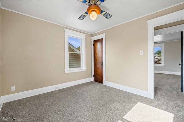 4305 W 49th St, Cleveland, OH 44144 - spare room with carpet floors, ornamental molding, and a ceiling fan