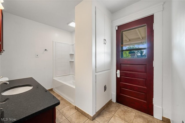 4305 W 49th St, Cleveland, OH 44144 - bathroom with vanity, tile patterned floors, and washtub / shower combination