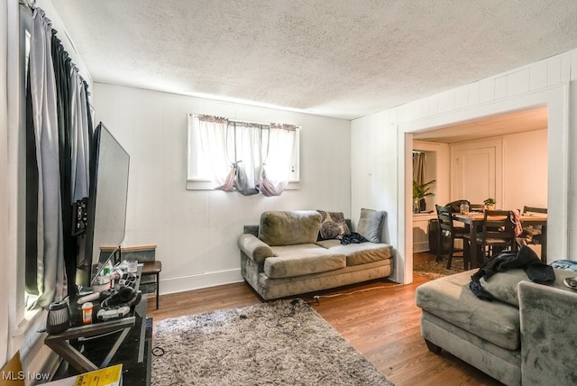 923 Lawton St, Akron, OH 44320 - living room featuring a textured ceiling and wood finished floors