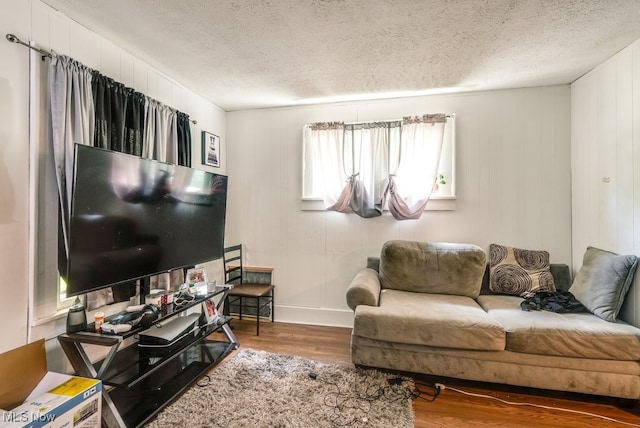 923 Lawton St, Akron, OH 44320 - living area featuring wood finished floors and a textured ceiling