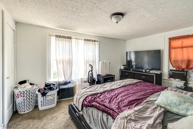 923 Lawton St, Akron, OH 44320 - bedroom with cooling unit, carpet, and a textured ceiling