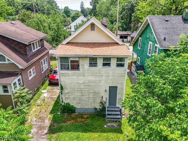 923 Lawton St, Akron, OH 44320 - rear view of house with a chimney and entry steps