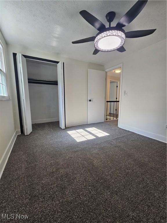 4590 Brendan Ln, North Olmsted, OH 44070 - unfurnished bedroom with a ceiling fan, carpet flooring, a textured ceiling, and a closet
