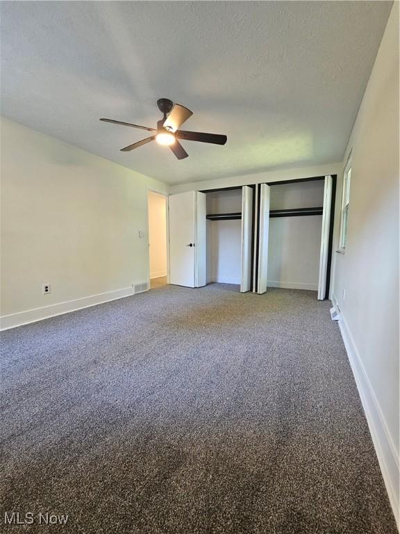 4590 Brendan Ln, North Olmsted, OH 44070 - unfurnished bedroom featuring carpet floors, a textured ceiling, and ceiling fan