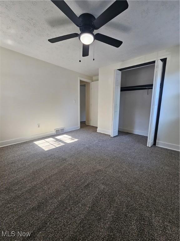 4590 Brendan Ln, North Olmsted, OH 44070 - unfurnished bedroom with ceiling fan, a closet, and carpet floors