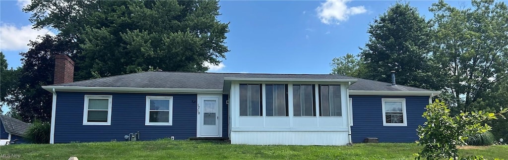 1719 Locust Ct, Wooster, OH 44691 - view of front facade with a chimney and a front lawn