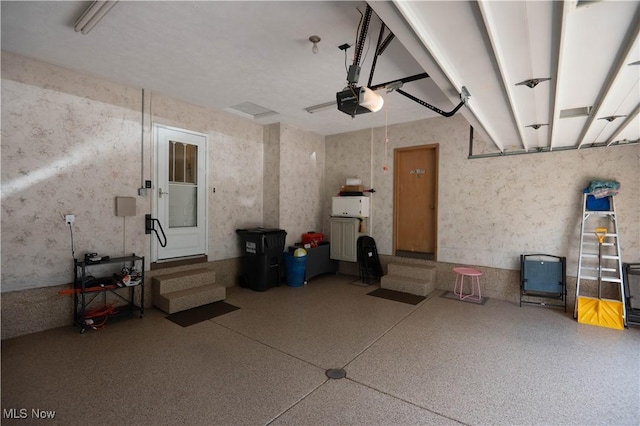 1074 S Meridian Rd, Austintown, OH 44509 - garage with a garage door opener and wallpapered walls