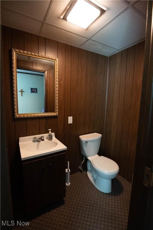 1074 S Meridian Rd, Austintown, OH 44509 - bathroom with vanity, wooden walls, and a paneled ceiling