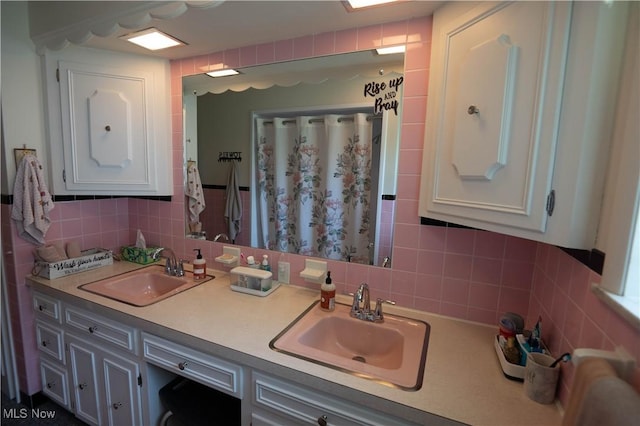 1074 S Meridian Rd, Austintown, OH 44509 - bathroom with tasteful backsplash, double vanity, tile walls, and a shower with shower curtain