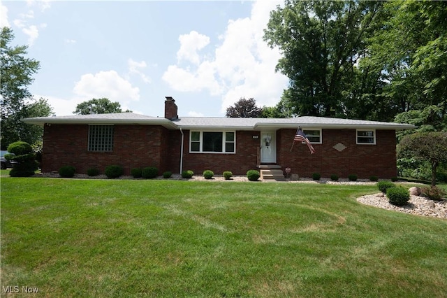 1074 S Meridian Rd, Austintown, OH 44509 - ranch-style house with brick siding, a chimney, and a front yard