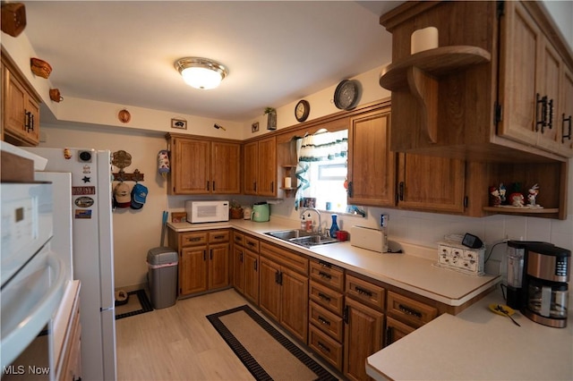 1074 S Meridian Rd, Austintown, OH 44509 - kitchen featuring open shelves, brown cabinets, and white appliances