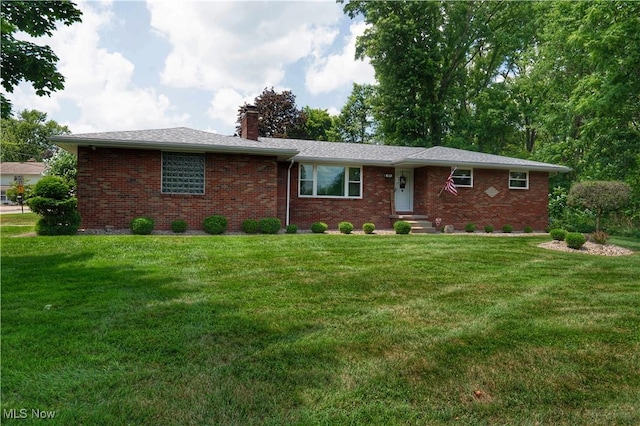 1074 S Meridian Rd, Austintown, OH 44509 - ranch-style house featuring a chimney, brick siding, and a front yard