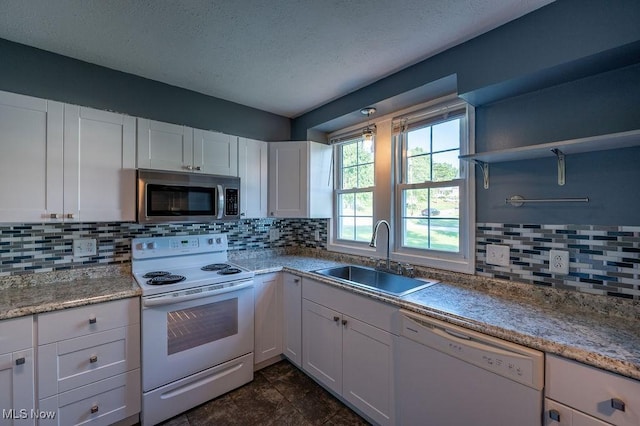 4412 14th Ave, Parkersburg, WV 26101 - kitchen featuring white appliances, open shelves, white cabinets, backsplash, and a textured ceiling