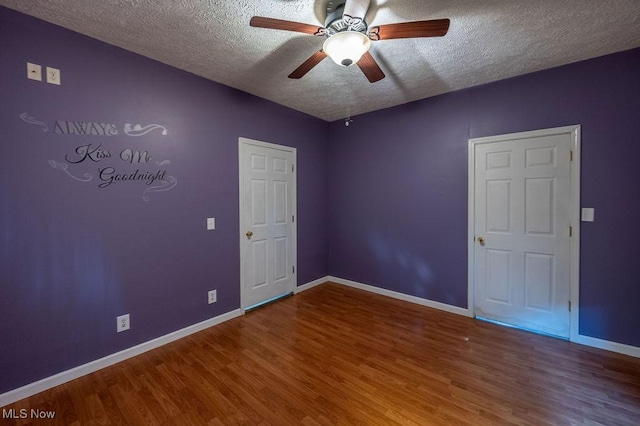 4412 14th Ave, Parkersburg, WV 26101 - unfurnished room with a textured ceiling, wood finished floors, and a ceiling fan