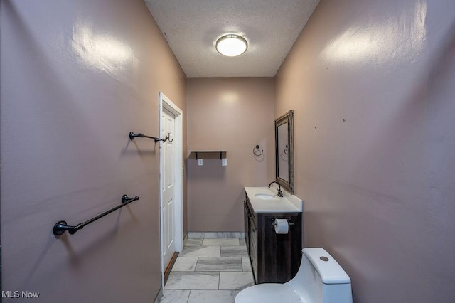 4412 14th Ave, Parkersburg, WV 26101 - half bathroom featuring vanity and a textured ceiling