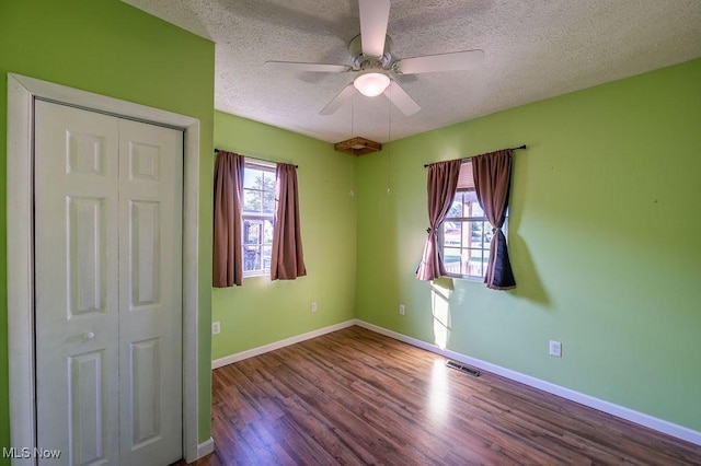 4412 14th Ave, Parkersburg, WV 26101 - empty room featuring wood finished floors, a textured ceiling, and a ceiling fan