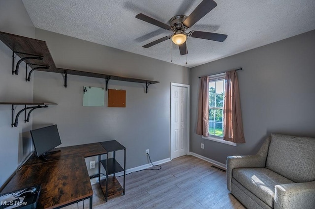 4412 14th Ave, Parkersburg, WV 26101 - home office featuring wood finished floors, a textured ceiling, and ceiling fan